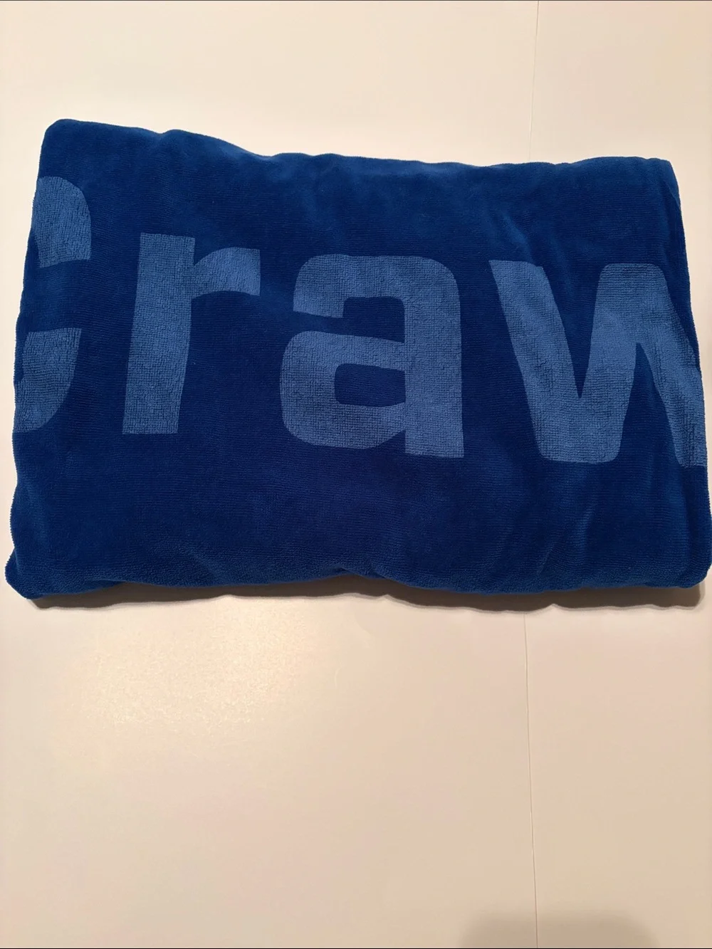Blue Beach Towel with Vertical “Crawford” Logo